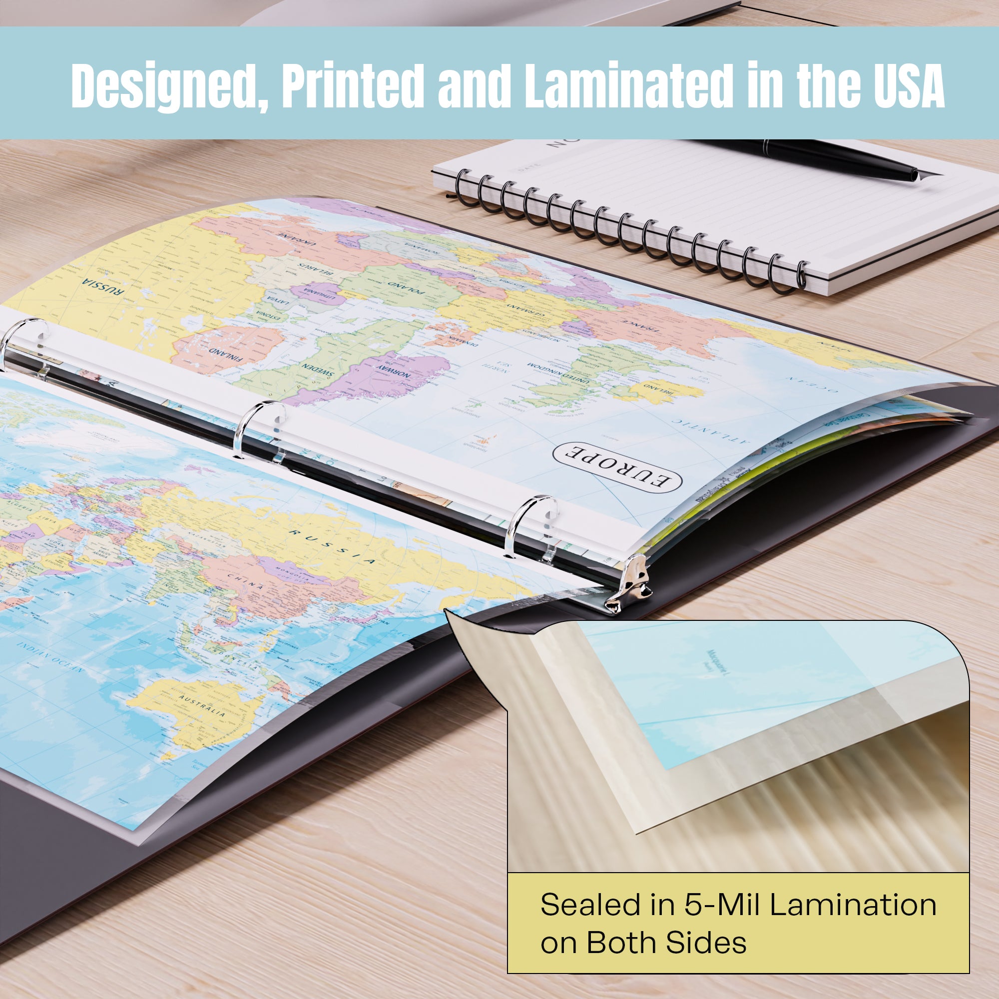 World map book on a wooden surface with text about design, printing, and lamination in the USA.