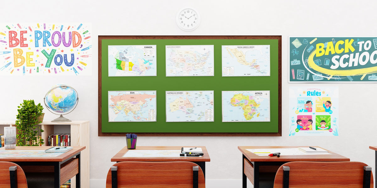 A classroom whiteboard displaying six laminated Jelly Bean Genius world and continent map posters
